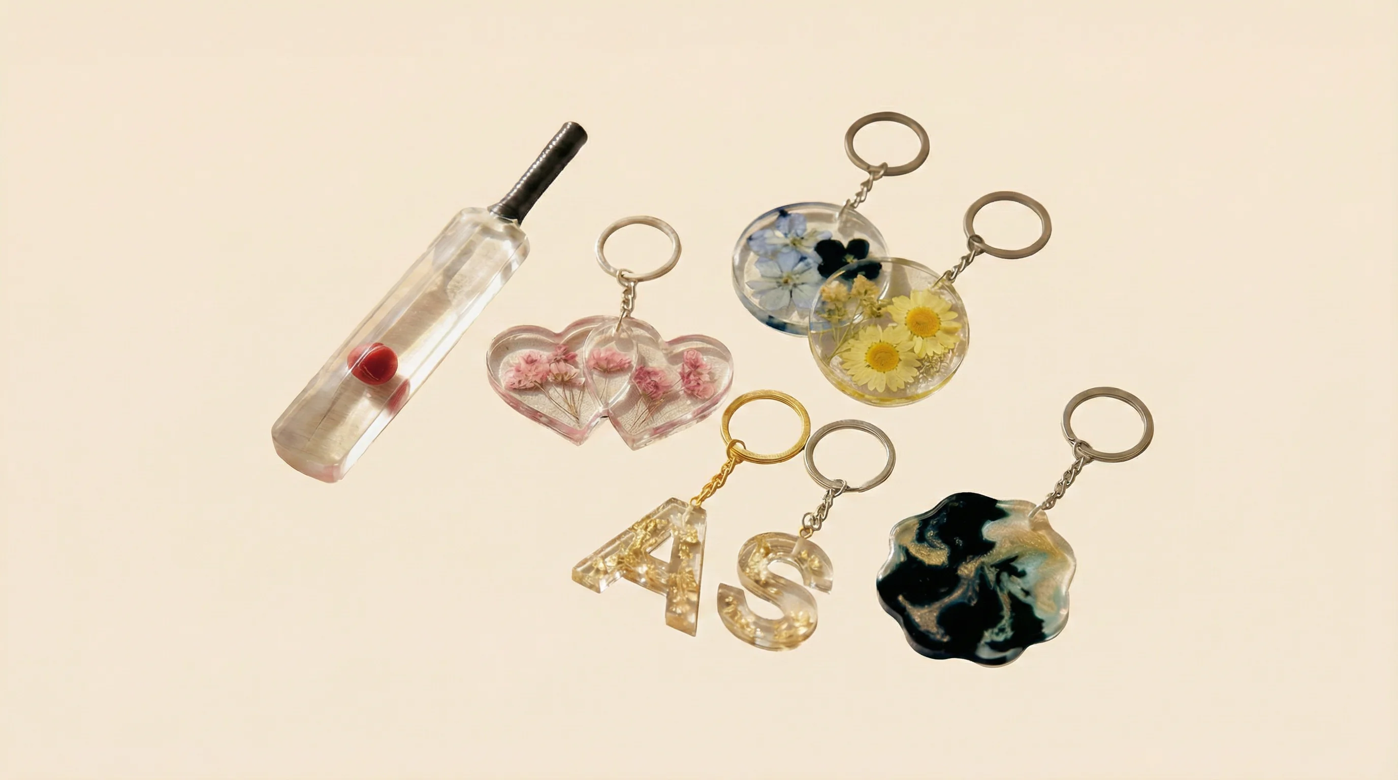 Keychains with real flowers, leaves, or petals preserved inside clear resin. 600x260px